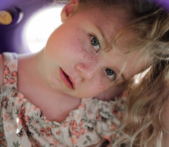 Child in Hopebridge Community At a Playground